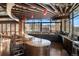 A clubhouse kitchen boasts granite countertops, stainless steel appliances, and barstool seating at 12575 Sandstone Dr, Broomfield, CO 80021