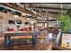 An open clubhouse features a pool table and seating near the fireplace and TVs at 12575 Sandstone Dr, Broomfield, CO 80021