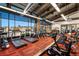 A fitness center with large windows offers treadmills and other exercise equipment at 12575 Sandstone Dr, Broomfield, CO 80021