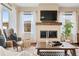 Bright living room features a modern fireplace, neutral walls, and stylish decor for a cozy ambiance at 12575 Sandstone Dr, Broomfield, CO 80021