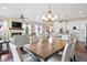 Open-concept living and dining areas featuring hardwood floors, fireplace, and abundant natural light at 12575 Sandstone Dr, Broomfield, CO 80021