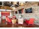 Inviting lounge area featuring a fireplace, comfortable seating, and stylish decor at 12575 Sandstone Dr, Broomfield, CO 80021