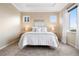 Serene main bedroom with plush carpeting, tray ceiling, ample natural light, and neutral decor at 12575 Sandstone Dr, Broomfield, CO 80021