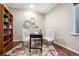 Home office space with built-in bookshelves, hardwood floors, and ample natural light at 12575 Sandstone Dr, Broomfield, CO 80021