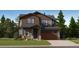 Charming two-story home featuring a two-car garage, well-maintained landscaping, and attractive architectural details at 7735 S Cherokee Trl, Centennial, CO 80016