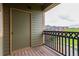 A cozy balcony features wood-look floors, stylish railings, and an exterior storage closet at 9633 E 5Th Ave # 10304, Denver, CO 80230