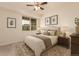 A bedroom with modern decor, including a patterned rug and a large window at 9633 E 5Th Ave # 10304, Denver, CO 80230