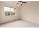 Bedroom with window and ceiling fan at 9633 E 5Th Ave # 10304, Denver, CO 80230