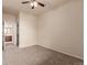 Spacious carpeted bedroom with ceiling fan and bathroom access at 9633 E 5Th Ave # 10304, Denver, CO 80230