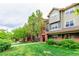 Well-maintained building exteriors feature manicured lawns and mature trees at 9633 E 5Th Ave # 10304, Denver, CO 80230
