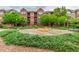 A landscaped community courtyard offers green spaces surrounded by attractive brick buildings at 9633 E 5Th Ave # 10304, Denver, CO 80230