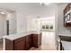Kitchen features an open concept with dark cabinets and a white island at 9633 E 5Th Ave # 10304, Denver, CO 80230