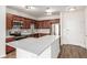Updated kitchen with stainless steel appliances, mosaic tile backsplash, and center island at 9633 E 5Th Ave # 10304, Denver, CO 80230