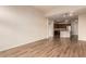 Open-concept living room flows into modern kitchen with stainless steel appliances and island at 9633 E 5Th Ave # 10304, Denver, CO 80230