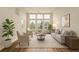 Bright living room features large windows, hardwood floors, and neutral decor at 9633 E 5Th Ave # 10304, Denver, CO 80230