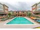 A sparkling community pool is surrounded by lounge chairs for resident relaxation at 9633 E 5Th Ave # 10304, Denver, CO 80230