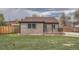 Beautiful backyard with lush green lawn and a wooden fence, perfect for outdoor activities at 6000 Yarrow St, Arvada, CO 80004