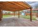 View of a large backyard and brick patio featuring a wooden cover and a storage shed at 6000 Yarrow St, Arvada, CO 80004