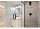 Bathroom showcasing subway tile in shower, glass door, modern vanity and fixtures at 6000 Yarrow St, Arvada, CO 80004