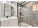 Bathroom with modern fixtures, a glass enclosed shower, and granite vanity at 6000 Yarrow St, Arvada, CO 80004