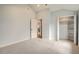 Bright bedroom featuring neutral carpet, closet and access to a full kitchen at 6000 Yarrow St, Arvada, CO 80004