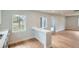 Bright kitchen with white cabinets, quartz countertops, and hardwood floors at 6000 Yarrow St, Arvada, CO 80004