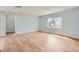 Bright living room with hardwood floors and a neutral color scheme at 6000 Yarrow St, Arvada, CO 80004