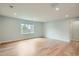 Bright living room featuring gleaming hardwood floors, recessed lighting, and neutral paint at 6000 Yarrow St, Arvada, CO 80004