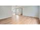Inviting living space showcasing hardwood floors, neutral paint, and ample natural light at 6000 Yarrow St, Arvada, CO 80004