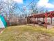 Backyard with a pergola, stone feature and a large grassy area at 1050 Youngfield St, Golden, CO 80401