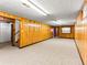 Spacious finished basement with carpet and wood paneling at 1050 Youngfield St, Golden, CO 80401