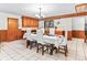 Spacious dining room with wood cabinets, chandelier, and tile flooring at 1050 Youngfield St, Golden, CO 80401