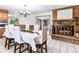 Elegant dining room featuring a brick fireplace and a large table set for a meal at 1050 Youngfield St, Golden, CO 80401