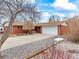 Charming red brick ranch-style home with mature landscaping and a two-car garage at 1050 Youngfield St, Golden, CO 80401