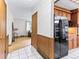 Hallway with wood-paneled walls that connects to a living room at 1050 Youngfield St, Golden, CO 80401