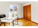 Office space featuring a desk, a chair, and hardwood floors at 1050 Youngfield St, Golden, CO 80401