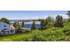This backyard features a beautiful lake view and mature trees at 11200 W 102Nd Ave, Broomfield, CO 80021