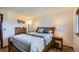 Bedroom featuring a well-made bed, soft natural light from the window, and a dresser, ready to provide rest at 11200 W 102Nd Ave, Broomfield, CO 80021