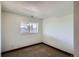 Small bedroom featuring an air vent and natural light from the window at 11200 W 102Nd Ave, Broomfield, CO 80021