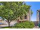 Two-story home featuring neutral siding, red shutters, large tree, and a two-car garage at 11200 W 102Nd Ave, Broomfield, CO 80021