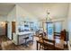 Bright kitchen features stainless steel appliances, a breakfast bar, and a dining area with a sliding door to the outside at 11200 W 102Nd Ave, Broomfield, CO 80021
