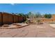 Backyard featuring a charming stone patio and mature landscaping at 163 Ward Ct, Lakewood, CO 80228