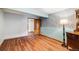 A bedroom with wood-look floors and an accent wall design at 163 Ward Ct, Lakewood, CO 80228