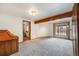 Bonus room with a wooden beam, desk and sliding glass doors at 163 Ward Ct, Lakewood, CO 80228