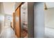 Hallway featuring walk-in closet and bathroom with tiled floors at 163 Ward Ct, Lakewood, CO 80228
