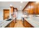 Modern kitchen with granite countertops, stainless steel appliances, and hardwood floors at 163 Ward Ct, Lakewood, CO 80228