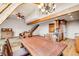 Open-concept living space with hardwood floors, dining area, and kitchen at 163 Ward Ct, Lakewood, CO 80228