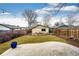 Backyard featuring a patio, grass, garden beds, string lights and fenced in yard at 2039 S Sherman St, Denver, CO 80210