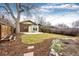 Backyard featuring a patio, grass, garden beds, string lights and fenced in yard at 2039 S Sherman St, Denver, CO 80210