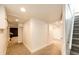 Finished basement with ample hallway space and access to rooms and staircase at 2039 S Sherman St, Denver, CO 80210